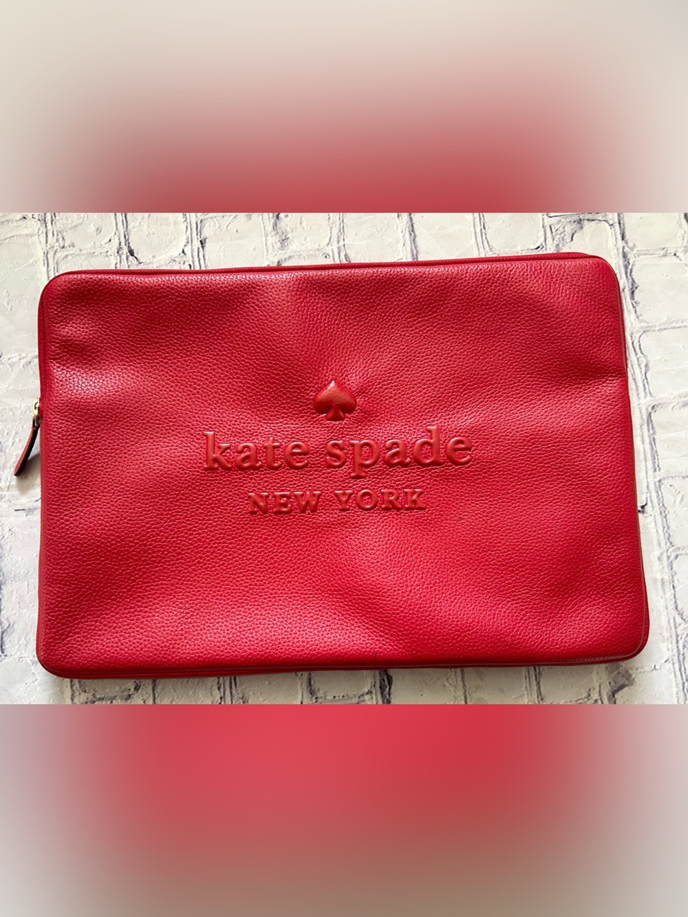 KATE SPADE New York red pebble laptop sleeve